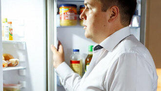 Man stares into fridge. He wonders why.